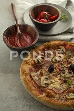 Pizza classic with cheese, ham, mushrooms Stock Photos