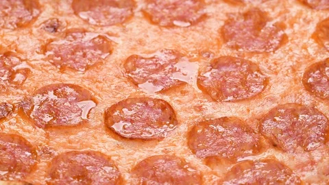 Pizza closeup with salami and cheese mozzarella 4k footage. Slow rotation of Stock Footage