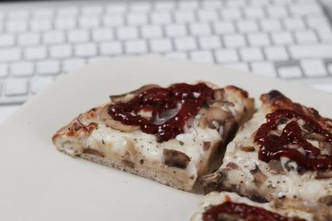Pizza computer keyboard Stock Photos