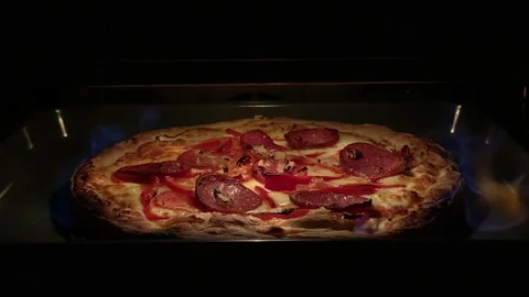Pizza cooked in flame 4K Stock Footage 165875360
