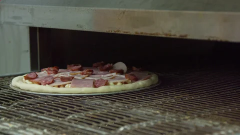 Pizza is cooked in the oven Stock Footage 142402082