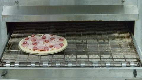 Pizza is cooked in the oven Stock Footage 142402217