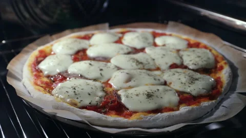 Pizza cooked in oven Stock Footage 182454301