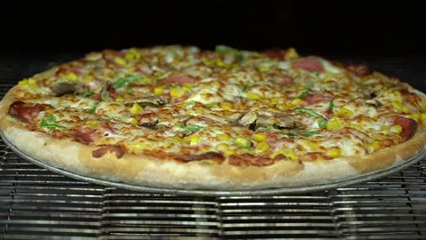 Pizza is cooking in the oven Stock Footage 187153345