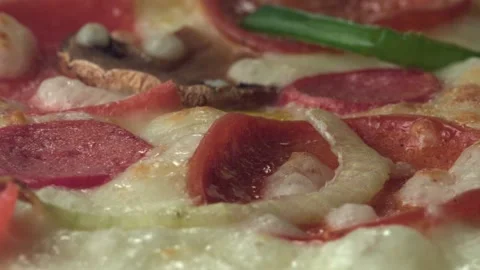 A pizza is cooking while it's rotating in the oven. Close up. Stock Footage 161526335