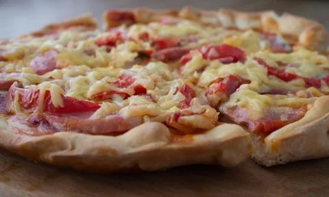 Pizza cut for the portion Stock Photos