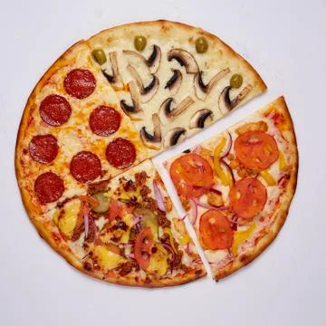 Pizza with cut off slice on a white background. Top view. Stock Photos