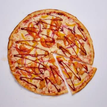 Pizza with cut off slice on a white background. Top view. Stock Photos