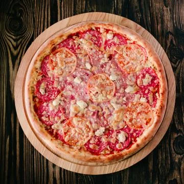 Pizza on a cutting board Stock Photos
