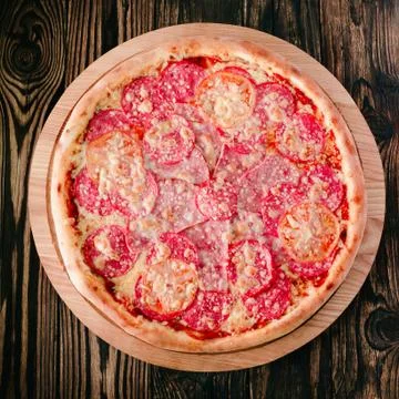 Pizza on a cutting board Stock Photos