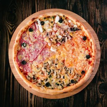 Pizza on a cutting board Stock Photos