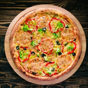 Pizza on a cutting board Stock Photos