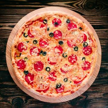Pizza on a cutting board Stock Photos