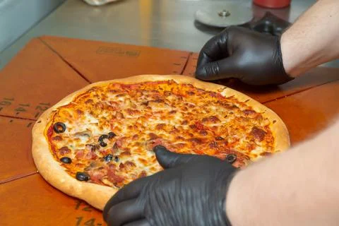 Pizza on a cutting board. Stock Photos