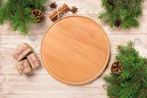 Pizza cutting board at table background with christmas decoration, Round bo.. Stock Photos