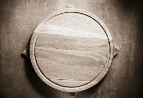 Pizza cutting board at table Stock Photos