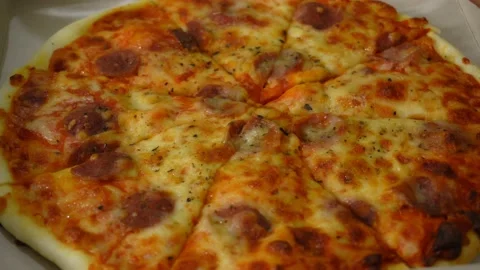 Pizza in a delivery box close-up. Stockbeeldmateriaal 146767052