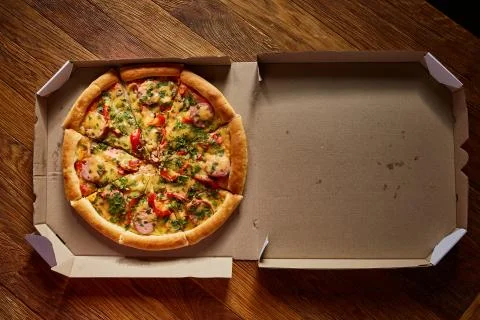 Pizza in the in delivery box. Stock Photos