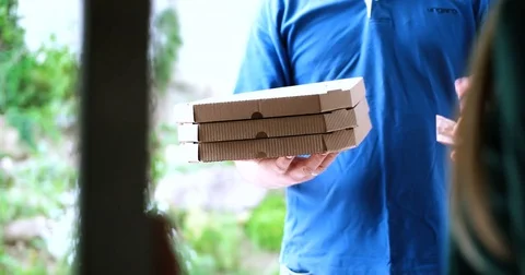 Pizza delivery guy delivering pizza Stock Footage