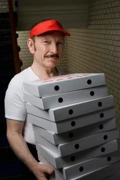 A pizza delivery man, portrait Stock Photos