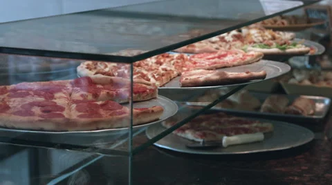 Pizza on display at a pizzeria Stock Footage 64890433