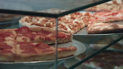 Pizza on display at a pizzeria Stock-Footage 64890457