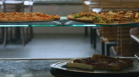 Pizza on display at a pizzeria Stock Footage 64890632