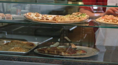 Pizza on display at a pizzeria Stock Footage 64891954