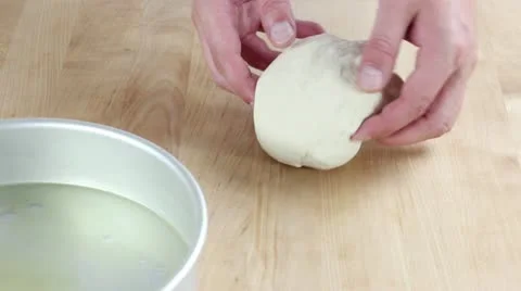 Pizza dough being rolled out Stock Footage 24672494