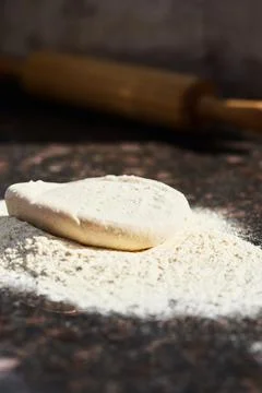 Pizza dough before rolling into a circle. The Stock Photos