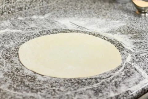 Pizza dough on table. Stock Photos