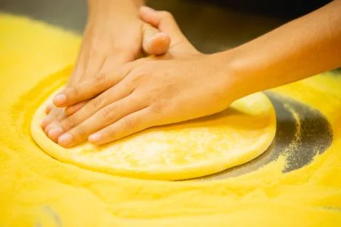 Pizza dough on the table in the restaurant. Stock Photos