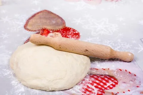 Pizza dough on the table with rolling pin Stock Photos