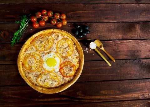 Pizza with egg on a beautiful background Stock Photos