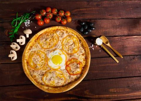 Pizza with egg on a beautiful background Stock Photos