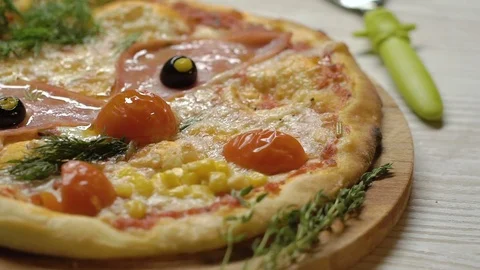 Pizza in the form of a funny face with a mustache from the leaves of dill, eyes Stock Footage 75234488