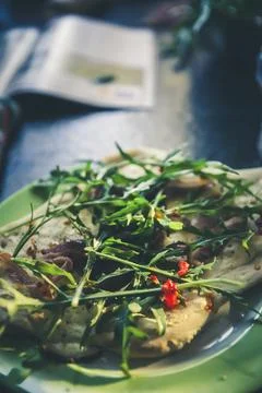 Pizza with fresh rocket salad Stock Photos