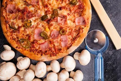 Pizza with garlic bread and measuring scoop 스톡 사진