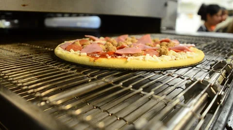 Pizza going into oven Stock Footage 39637403