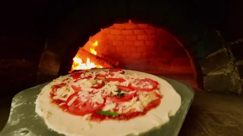 Pizza is going into the oven Stock Footage 259048244