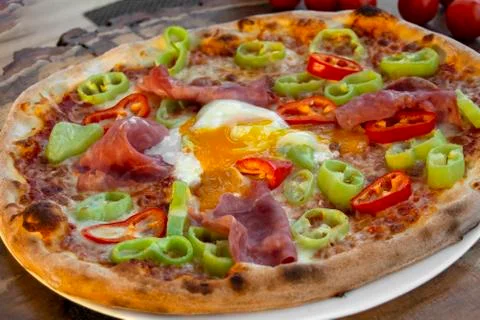 Pizza with ham and egg. Stock Photos