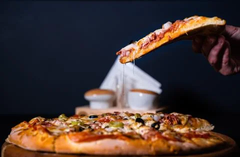 Up Pizza hand Stock Photos