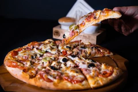 Up Pizza hand Stock Photos