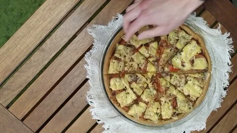 Pizza with hands taking slices Top view Stock Footage 103588902