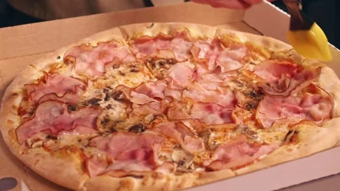 Pizza maker greases pizza with olive oil Stock Footage 158403904