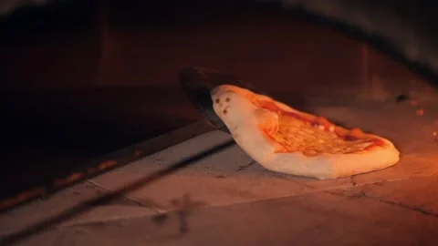 Pizza maker puts rolled dough with ketchup to bake in oven Stock Footage 132473983
