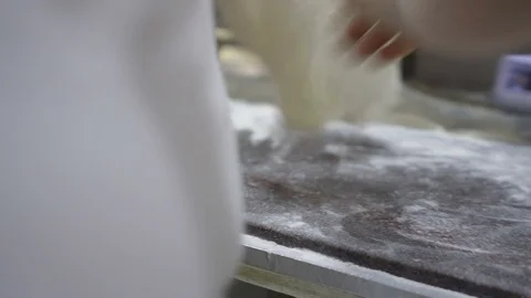 A pizza maker puts the tomato on the dough. Stock Footage 91853647