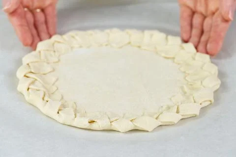 Pizza making process. Top view of pizza dough base. Home-baking pizza with a Stock Photos
