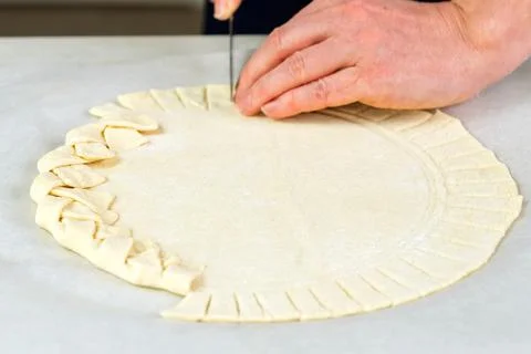 Pizza making process. Top view of pizza dough base. Home-baking pizza with a Stock Photos