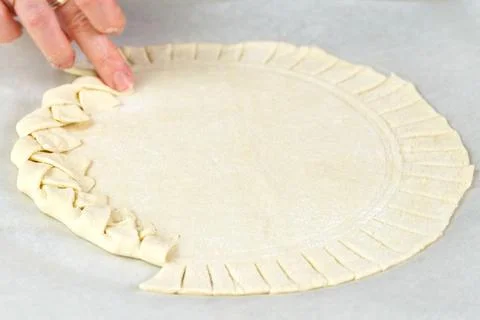 Pizza making process. Top view of pizza dough base. Home-baking pizza with a Stock Photos